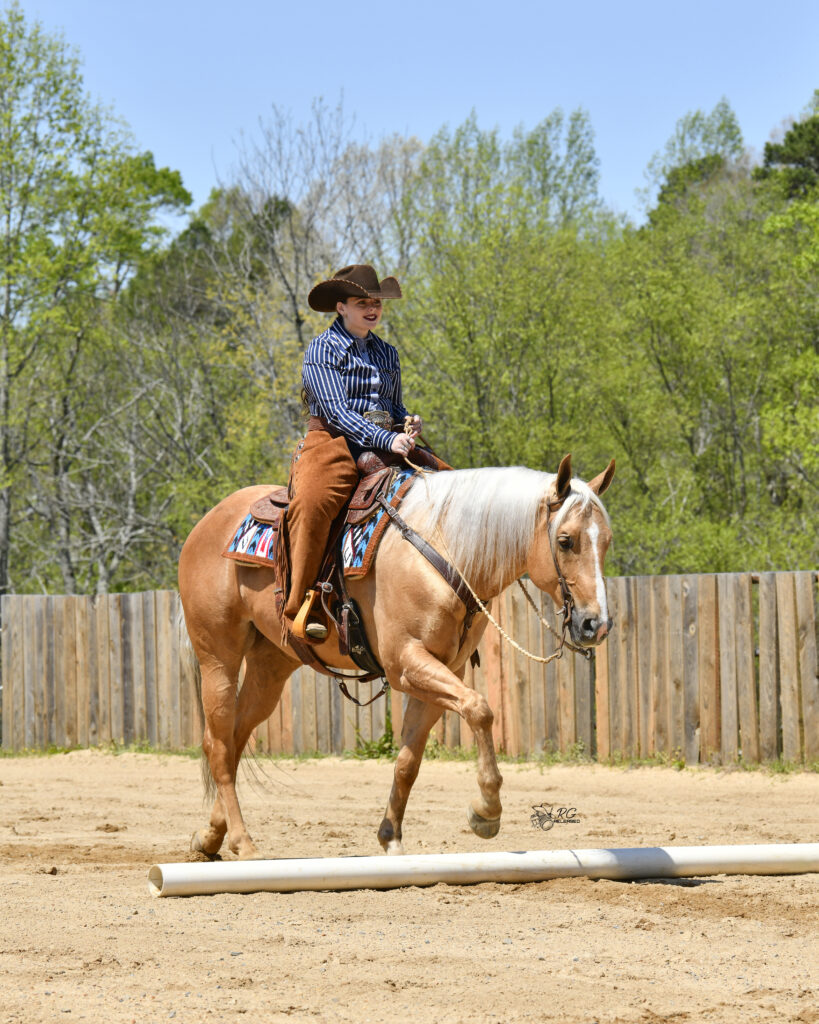 Lexi Edsall and her palomino quarter horse Shiner Surprize